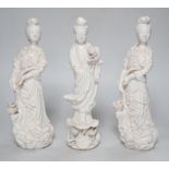 Three Chinese blanc de chine figures of Guanyin, 25cm