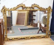 A rococo revival carved giltwood landscape mirror, width 160cm, height 113cm