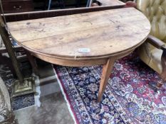 An early 19th century continental fruitwood D shaped folding tea table, width 124cm, depth 60cm,