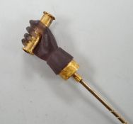 A cased 19th century yellow metal and amethyst glass? set Stanhope stick pin, modelled as hand