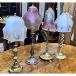 Two Edwardian silver plated and brass table lamps with etched cranberry shades and two converted