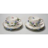 A pair of Meissen floral-encrusted cabinet cups and saucers, late 19th century, saucers 14cm diam.