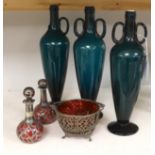 Three green glass flasks, a ruby glass basket and two overlaid ruby glass scent bottles, tallest