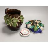 A Portuguese maiolica pottery wall pocket, a Rye pottery jug and three creamware dolls house plates