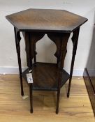 An early 20th century Liberty style hexagonal oak two tier occasional table, width 51cm, height