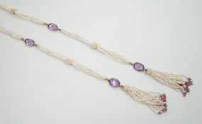 A 19th century Indian multi strand seed pearl and oval cut amethyst set long necklace, with gem