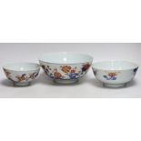 A graduated set of three Chinese Imari bowls, Qianlong period, hand painted with flowers, the