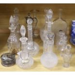 A collection of fourteen Victorian and later glass decanters, a glass funnel, a plated claret jug,