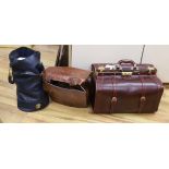 An oxblood leather Gladstone bag, a faux crocodile bag and one other