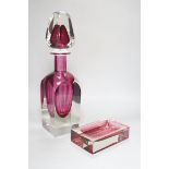 A large oversized Murano studio glass tear drop perfume bottle and a cranberry ashtray, the