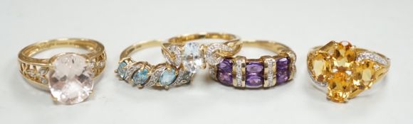 Five assorted modern 9ct gold and gem set dress rings, including citrine and diamond and amethyst