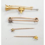 A Victorian yellow metal and diamond cluster set fox head pin, 44mm, two other fox head pins and a