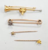 A Victorian yellow metal and diamond cluster set fox head pin, 44mm, two other fox head pins and a
