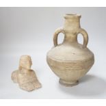 An Egyptian style alabaster model of a sphinx and a twin handled pottery vase, the largest 25cm