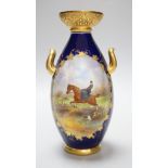 A Grainger & Co. Worcester two handled vase painted with a fox hunting scene in a raised gilt