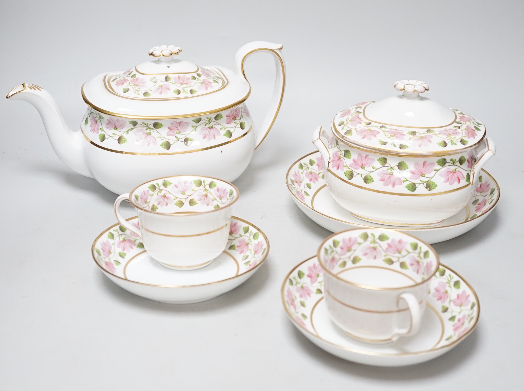 An early 19th century part tea service, teapot and cover, a sucrier and cover, two cups and