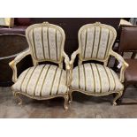 A pair of Louis VI style parcel gilt cream painted fauteuils, width 65cm, depth 52cm, height 92cm