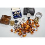 A small collection of costume jewellery, including silver pendants, amber necklace etc, together