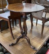A George III and later mahogany circular tilt top tripod wine table with associated base, diameter