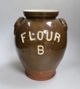 An early 20th century pottery jar inscribed ‘Flour B’, 30cm high
