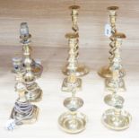 Four pairs of brass candlesticks, and another three converted to lamps, tallest 31cms high
