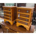 A pair of reproduction yew four drawer bedside chests, width 41cm, depth 32cm, height 60cm