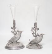 A matched pair of silver plated bird vases, with glass flutes, one with etched decoration, the