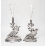 A matched pair of silver plated bird vases, with glass flutes, one with etched decoration, the