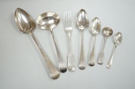 A collection of George III and later silver flatware including a sauce ladle, six Old English