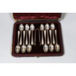 A cased set of twelve late Victorian silver Old English pattern teaspoons and tongs, London, 1892.