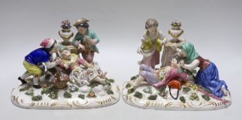 A pair of German porcelain figure groups of children wearing 18th century dress, each with floral