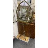 A 20th century French tubular brass glazed bird cage on tripod stand, height 152cm