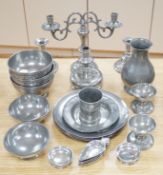 A collection of 19th/20th century pewter plates, bowls, candlesticks, etc.