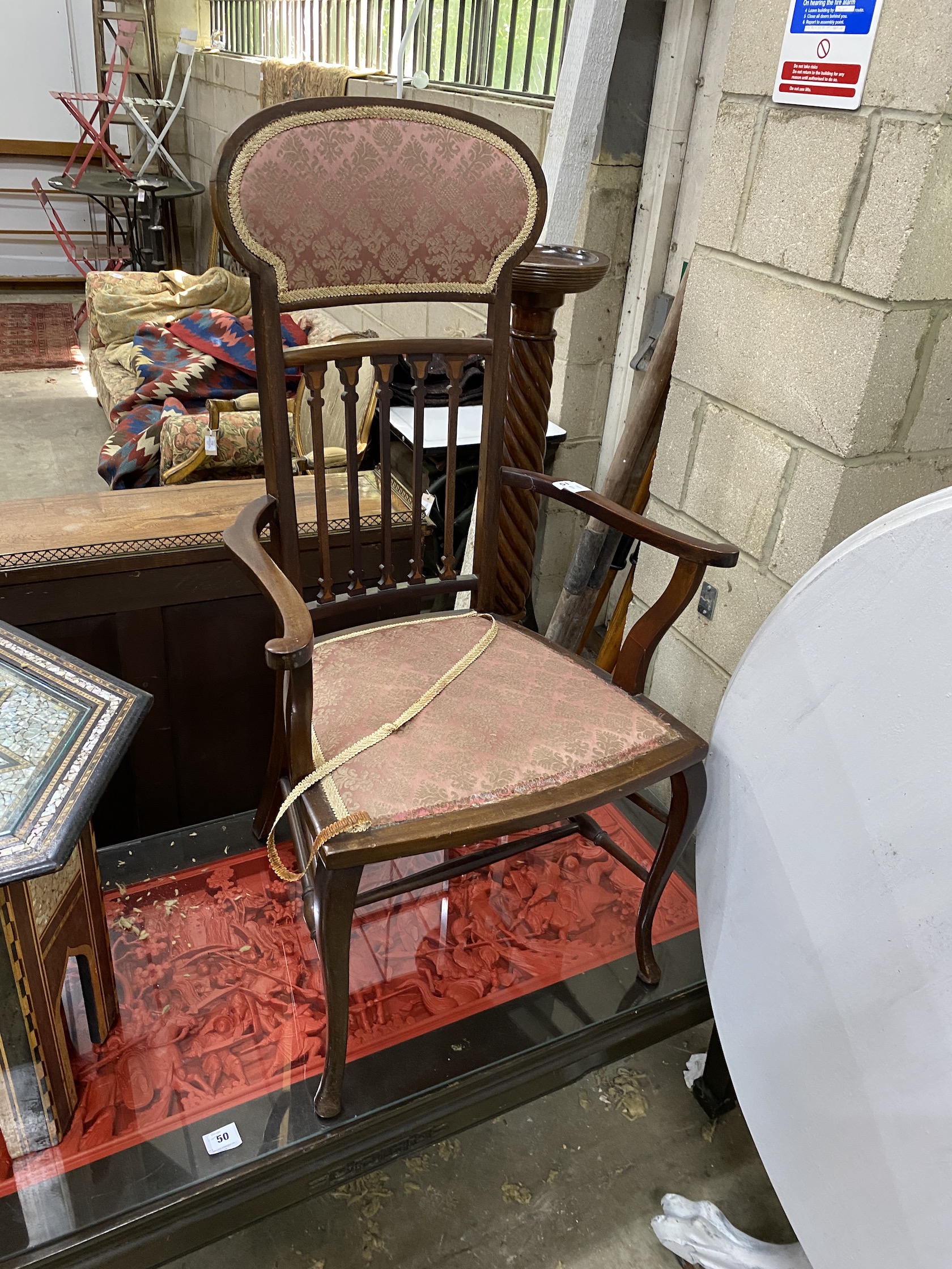 An Edwardian Art Nouveau inlaid mahogany elbow chair