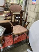 An Edwardian Art Nouveau inlaid mahogany elbow chair