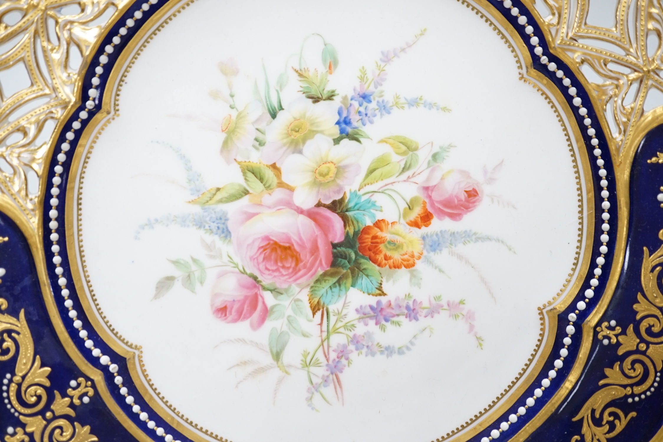 A Coalport plate with pierced border enamelled with white flowers and neo-classical raised paste - Image 2 of 3