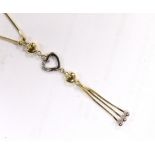 A modern two colour 14k and three white stone set heart drop tassel necklace, 56cm, gross weight,