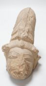 An Indian carved sandstone head of a Hindu deity, 19.5cm