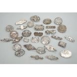 A small collection of twenty nine assorted Victorian and later silver or white metal brooches.