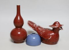 A small Chinese sang de boeuf glazed double gourd vase, 17cm high, and a Chinese sang de boeuf