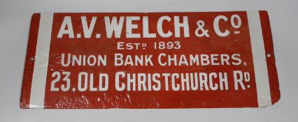 An enamel advertising sign: A.V. Welch & Co Established 1893 sign