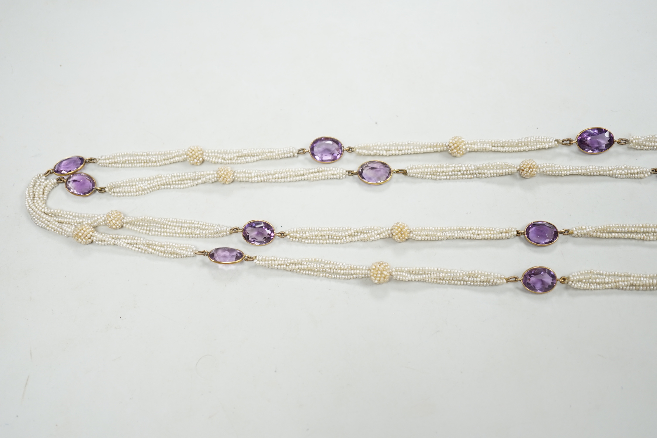 A 19th century Indian multi strand seed pearl and oval cut amethyst set long necklace, with gem - Image 2 of 4