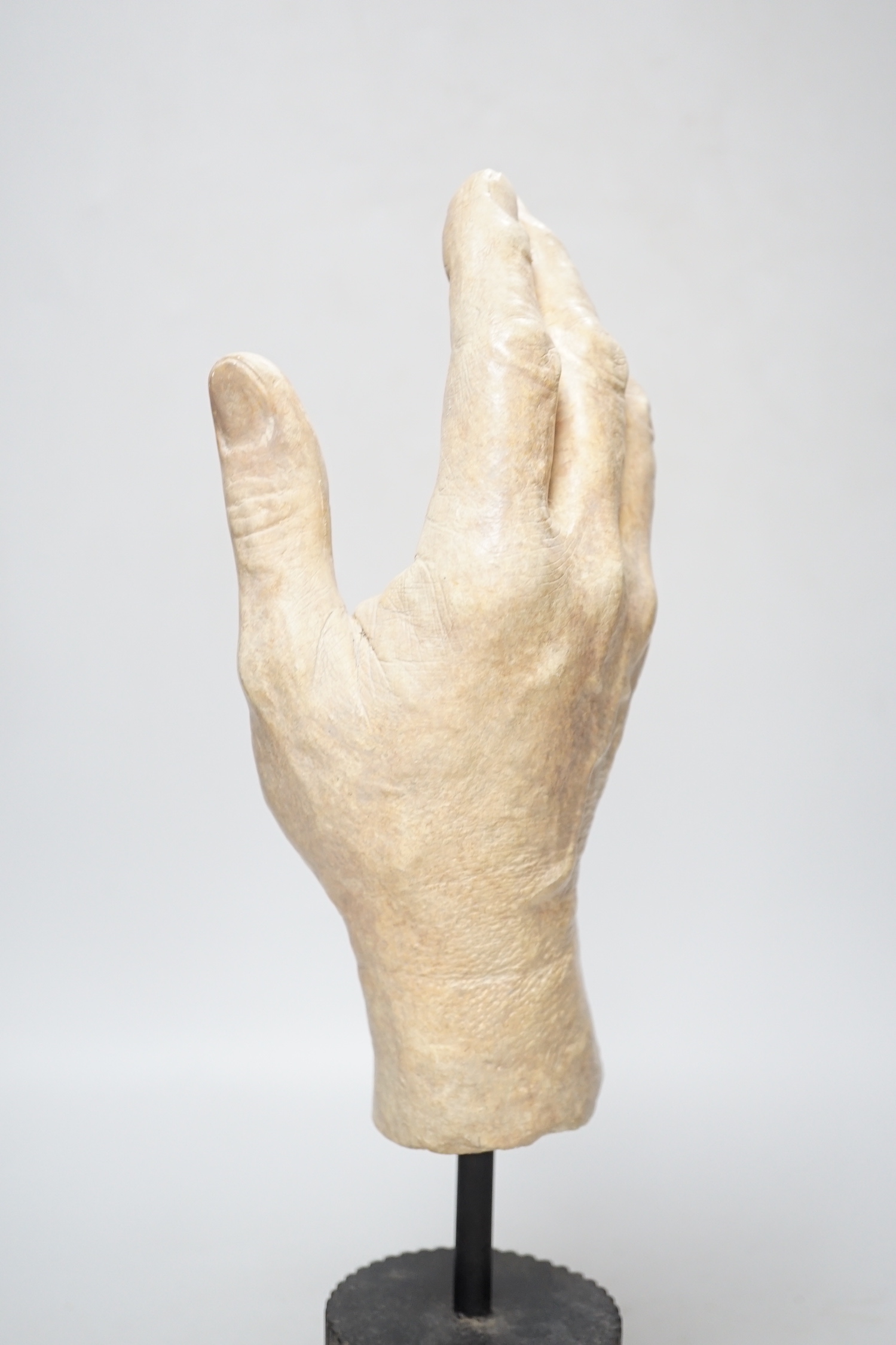 A composition model of a hand raised on a circular column base, 38cm high - Image 3 of 4