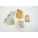 A collection of Chinese jade and soapstone carvings, largest a carved panel 11cm long