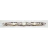 A Belle Epoque pierced yellow and white metal, cultured? pearl and diamond set bar brooch, 84mm,