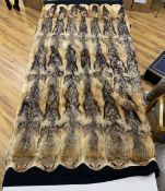 Taxidermy: a coyote fur felt lined rug, label for International Fur Store, Regent Street, London