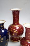 A pair of late 19th century French porcelain vases, and two others, tallest 25cm high