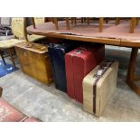Four vintage suitcases, largest 74 x 51cm