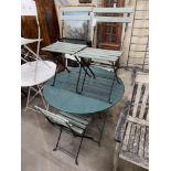 A circular metal folding garden table, diameter 96cm, height 72cm together with four slatted folding