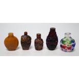 Five Chinese glass or amber snuff bottles, 7.4 cm high